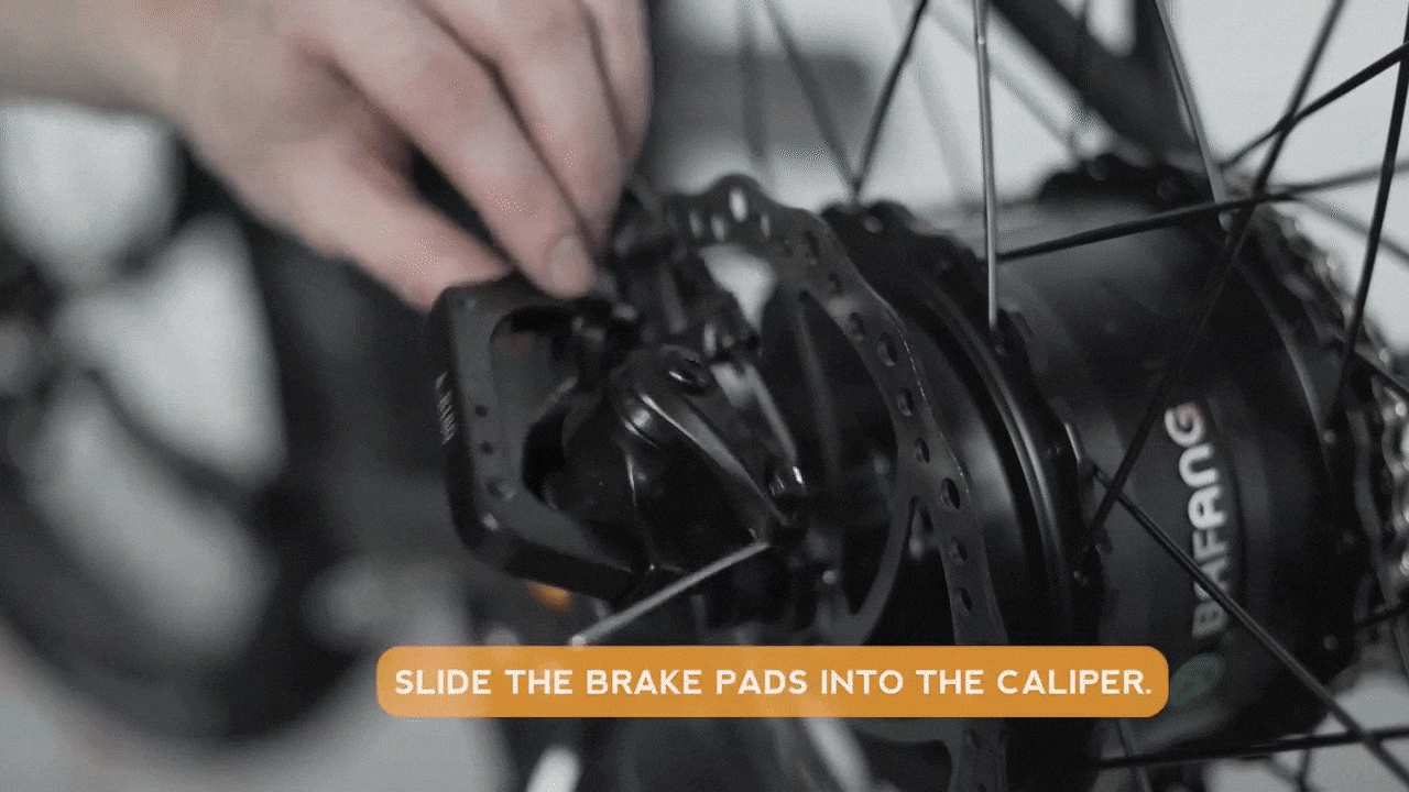 Install_brake_pads_in_caliper.gif